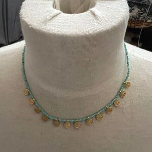 Gold and turquoise bead and charm necklae